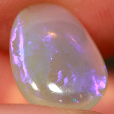 SOLID CRYSTAL OPAL Transparent with a pretty purple jumping